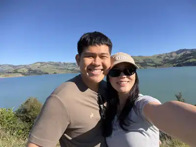 Gabriel and Estella taking a selfie by the water