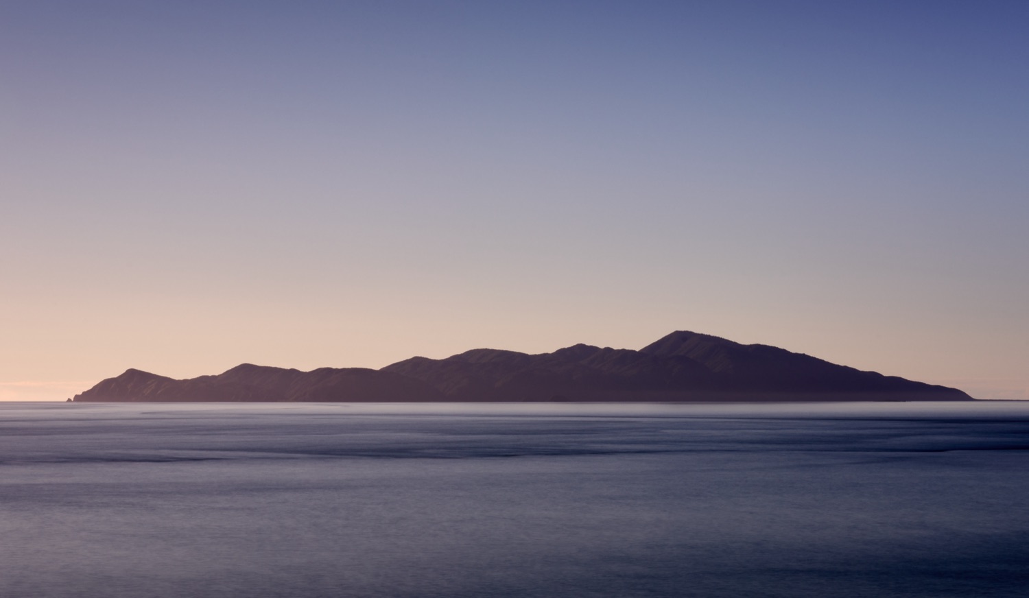 Kāpiti Island at dusk seen from the Kāpiti Coast